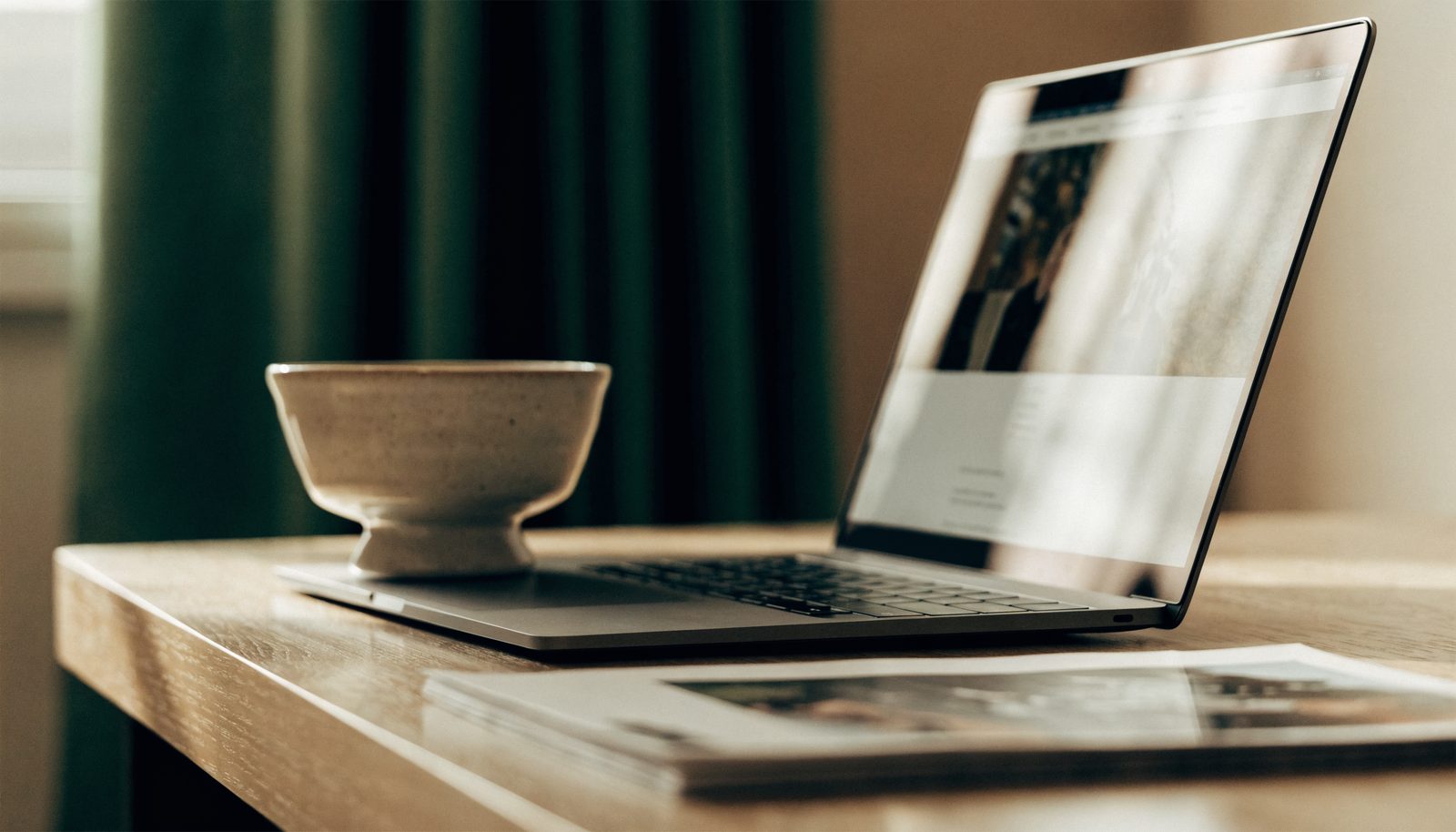 A photography portfolio website open on a laptop